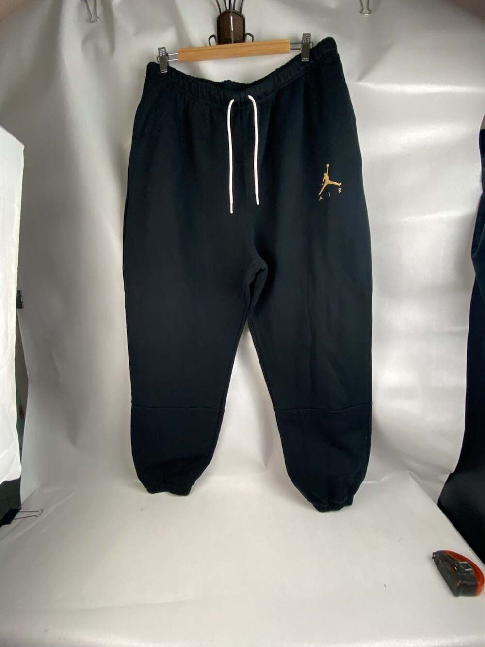 Jordan Jumpman Air Fleece Jogger Pants in Black with Gold Logo